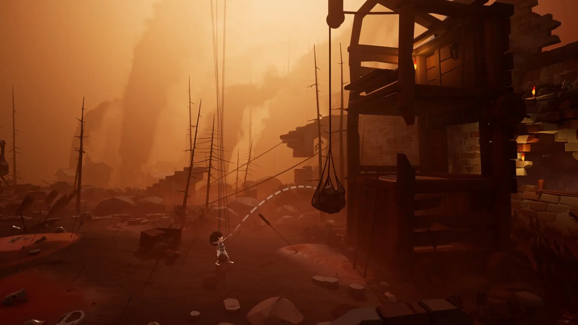 Abby dwarfed by a wooden scaffold in a hazy orange gorge